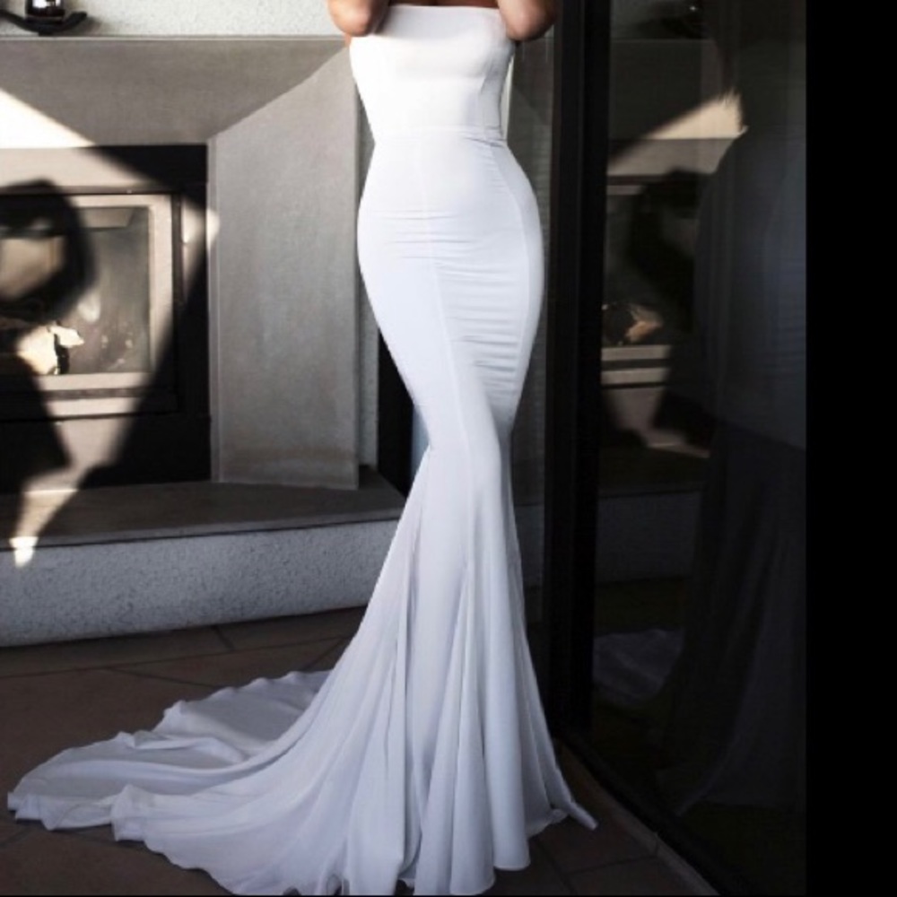 Strapless white mermaid gown, with a mini train.